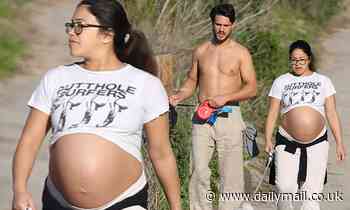 Heavily pregnant Gina Rodriguez looks ready to pop on a dog walk with husband in Los Angeles