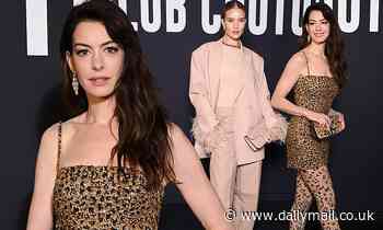 Anne Hathaway dazzles as she joins Rosie Huntington-Whitely at Valentino's PFW show