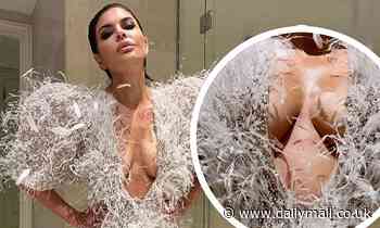 Lisa Rinna flashes cleavage at Paris Fashion Week