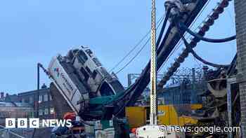 Road closed after machinery lands on building in Stoke-on-Trent - bbc.com