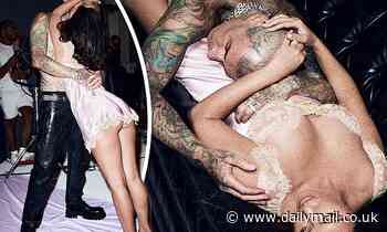 Kourtney Kardashian flashes her chest and pert butt in silky slip with husband Travis Barker