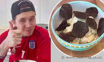 Brooklyn Beckham sports number seven England shirt as he whips up a tagliatelle