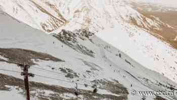 2 ski patrol spend night with man caught in avalanche in Alberta