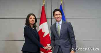 Premier Danielle Smith greets Prime Minister Trudeau with awkward handshake, grimace