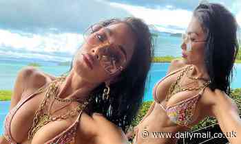 Nicole Scherzinger slips into floral bikini while soaking up the sun during trip to Australia