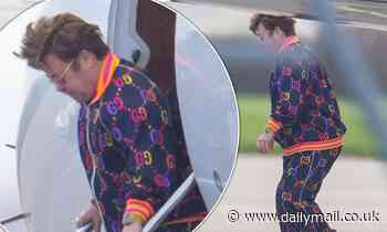 Elton John cuts a casual figure in a colourful tracksuit