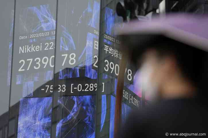 Wall Street swings as questions about banks, rates linger