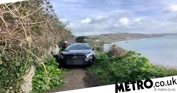 Mercedes driver takes wrong turn down coastal path and abandons car
