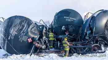 Crews work around the clock to put out blaze after train carrying highly flammable ethanol derailed in Minnesota