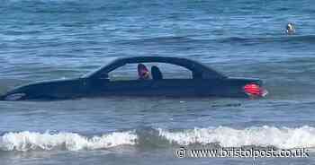 'You can’t park there!' - BMW washed out to sea after parking on West Country beach