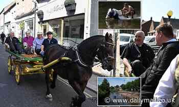 Archbishop of York rides a horse-drawn carriage around Appleby fair as he meets travellers