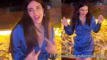 Nehhaa Malik dances her heart out wearing a blue thigh-high dress with a plunging neckline