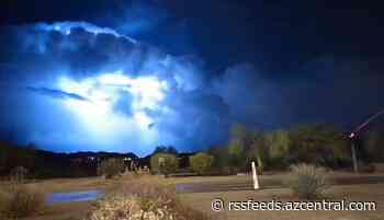 Lightning flashes in the clouds over east Mesa after rain and wind estimated at 80 mph