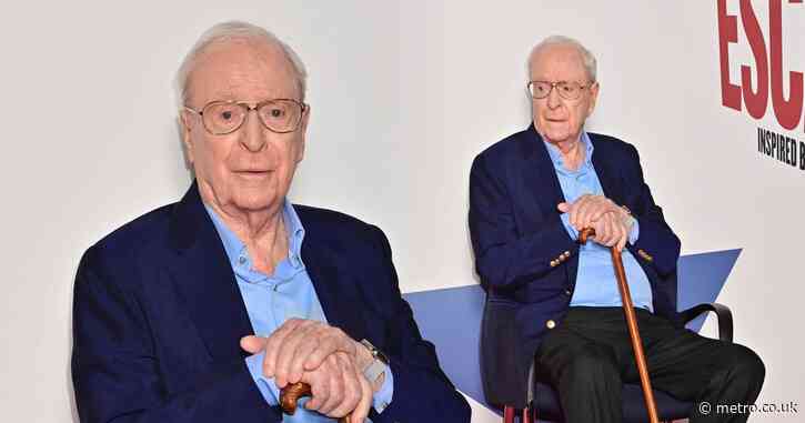 Sir Michael Caine, 90, helped onto red carpet with walking stick during rare public appearance