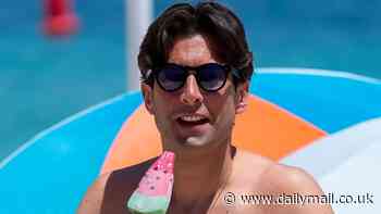 Shirtless James Argent showcases his incredible 13 stone weight loss as he hits the beach in Marbella and tucks into an ice cream