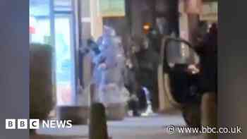 Watch: Armed police raid takeaway searching for Clapham attack suspect