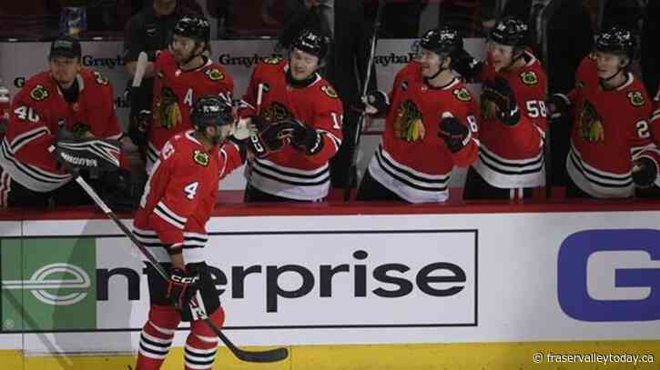 Dickinson scores twice, last-place Blackhawks smother Flames 3-1