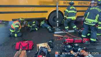 Wash. firefighters rescue boy on bike pinned under school bus