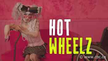 Hot Wheelz is a 'drag creature' in a wheelchair here to make magic out of their disability