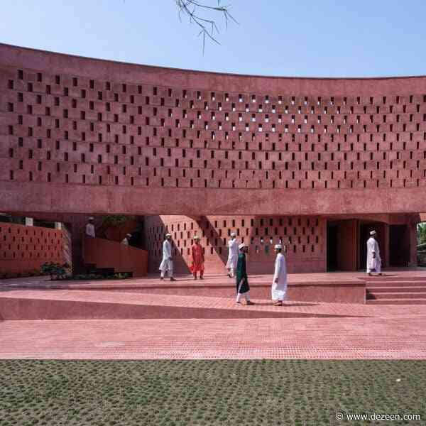 Studio Morphogenesis wraps waterside mosque in Bangladesh in perforated pink concrete