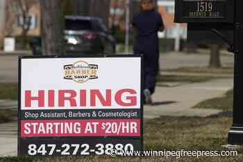 Applications for US unemployment benefits dip to 210,000 in strong job market