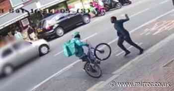 Horrifying moment machete madman hacks innocent Deliveroo cyclist on busy street