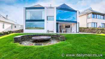 Five-bed clifftop home 'designed to look like binoculars' with panoramic views over picturesque Cornish bay goes on the market for £5m