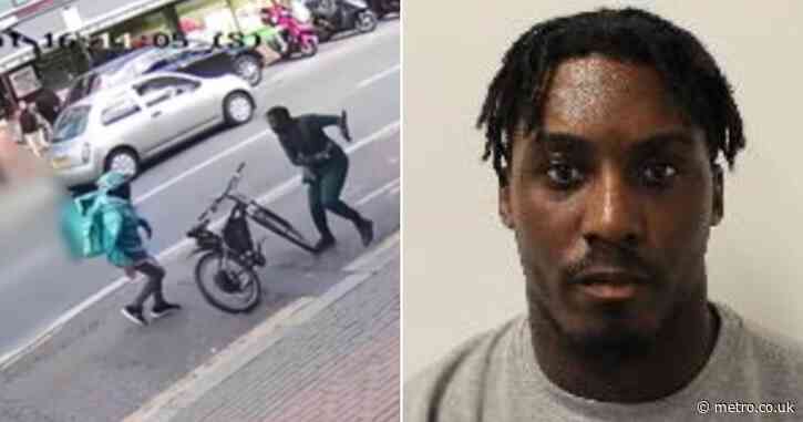 Shocking moment Deliveroo rider is stabbed by robber on busy street