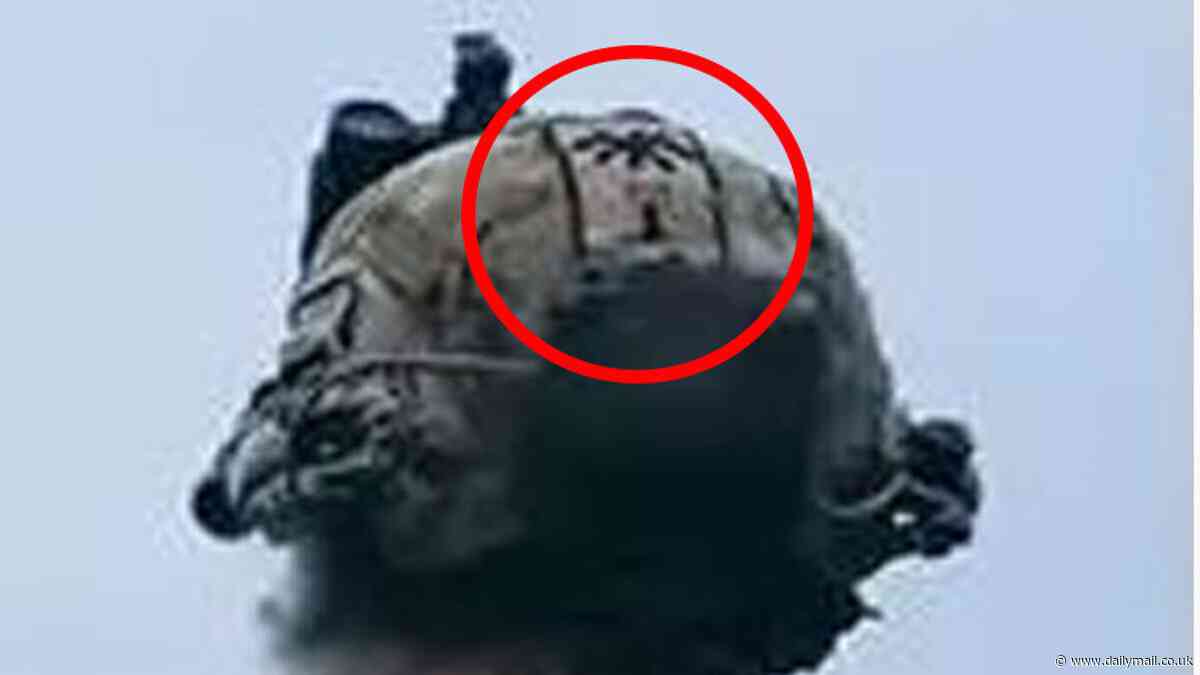 US Army launches urgent probe after Alabama-based Special Forces soldier was seen with badge for HITLER'S brutal SS Totenkopf division on his helmet