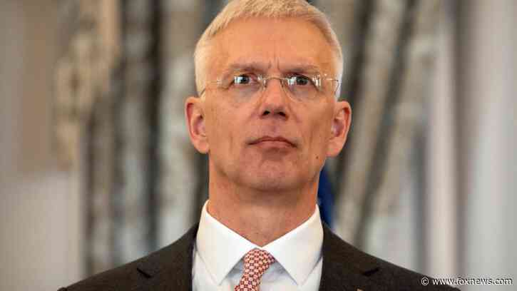 Latvia's foreign minister will step down after a probe over his office's use of private flights
