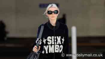 Julia Fox declares herself a 'sex symbol' while clad in a $325 Namilia velour tracksuit for flight to LA