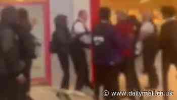 Moment 300 children storm shopping centre, causing mayhem by charging through mall, screaming and clashing with security - as police issue dispersal order following 'antisocial' chaos