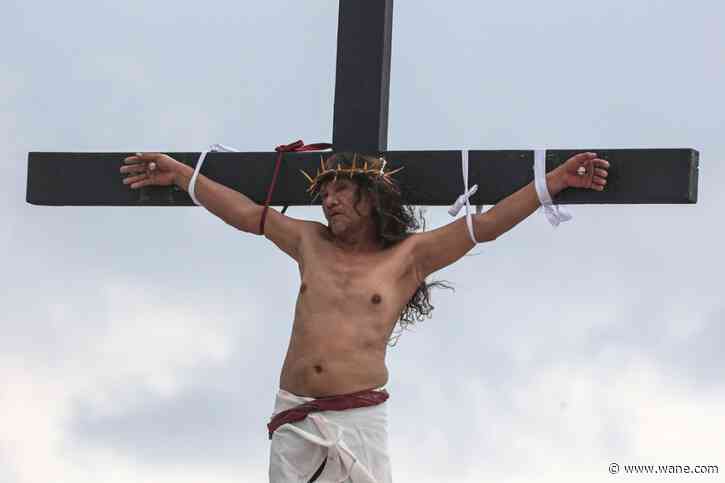 A Filipino villager is nailed to a cross for the 35th time on Good Friday to pray for world peace