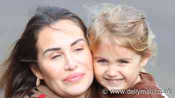 Chloe Goodman plant a sweet kiss on daughter Isla, 3, on family shopping trip - amid 'feud' with sister Lauryn