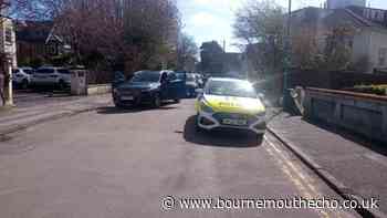 Police seen searching for man threatening violence in Bournemouth