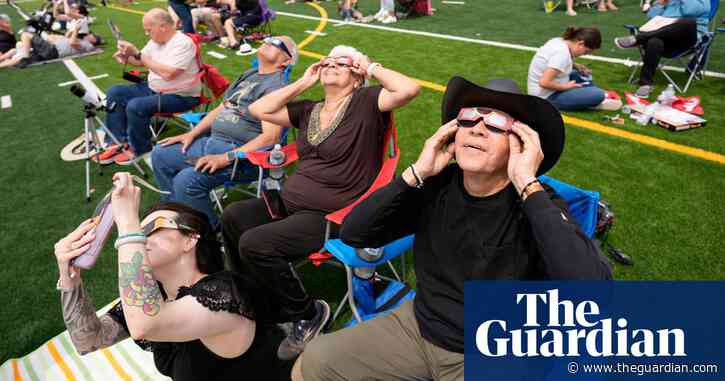 Millions watch as total solar eclipse sweeps across Mexico, US and Canada – video