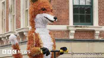 Giant fox stars in street festival