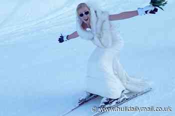 Bride says 'I do' 2,600m up snowy mountain then skis down in dress