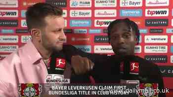 Jeremie Frimpong's jubilant interview after winning the Bundesliga with Bayer Leverkusen goes viral as he leans on the presenter's shoulder and calls him 'handsome'