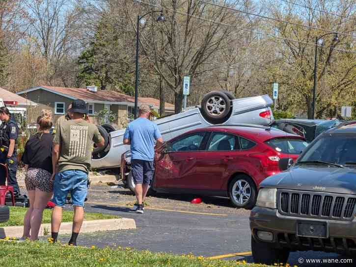 Crash causes car to flip in front of auto repair shop on Dupont Road