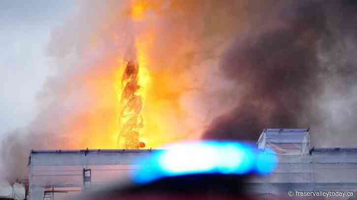 Fire rages through the 17th-century old Stock Exchange in Copenhagen and its spire has collapsed