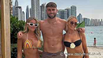 Love Island's Molly Smith shows off her toned figure in a colourful bikini as she joins shirtless boyfriend Tom Clare and his sister on the beach in Dubai