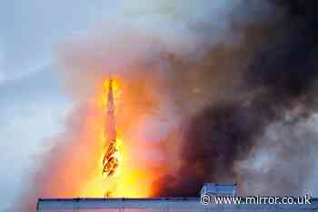 Copenhagen stock exchange fire: Terrifying moment spire topples as 400-year-old landmark in flames