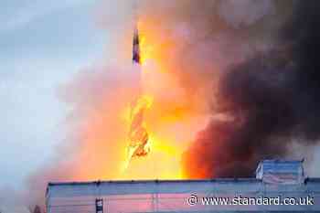 Copenhagen stock exchange fire: Spire collapses as historic tourist attraction engulfed by blaze