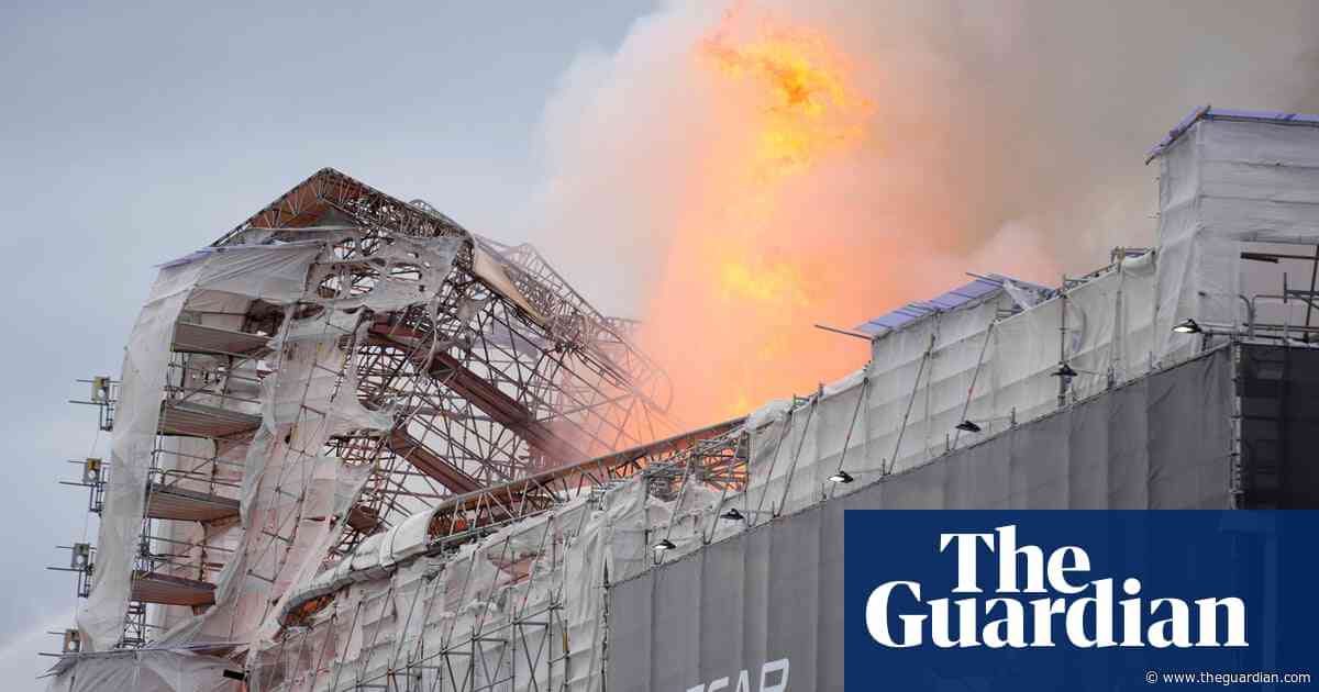 Spire collapses after fire breaks out at Copenhagen’s old stock exchange