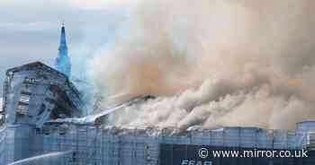 Shock images show Copenhagen Stock Exchange destroyed and shrouded in smoke as blaze ravages building