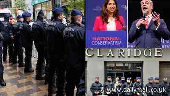 Fury as police barricade entrance to right-wing conference in Brussels attended by Nigel Farage and Suella Braverman after local mayor issues a BAN and says 'far-right' are 'not welcome'