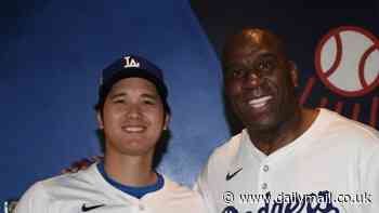 Magic Johnson and Shohei Ohtani pose for a picture at the LA Dodgers' defeat by the Washington Nationals after NBA legend gave moving speech to fans on Jackie Robinson Day