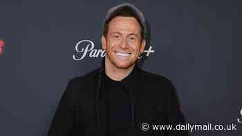 Joe Swash is all smiles as he poses with son Rex, four, and friend at the premiere of Knuckles in London