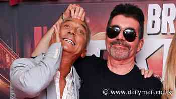 Simon Cowell playfully pulls Bruno Tonioli's ear as judges bring some humour to the red carpet at Britain's Got Talent press launch